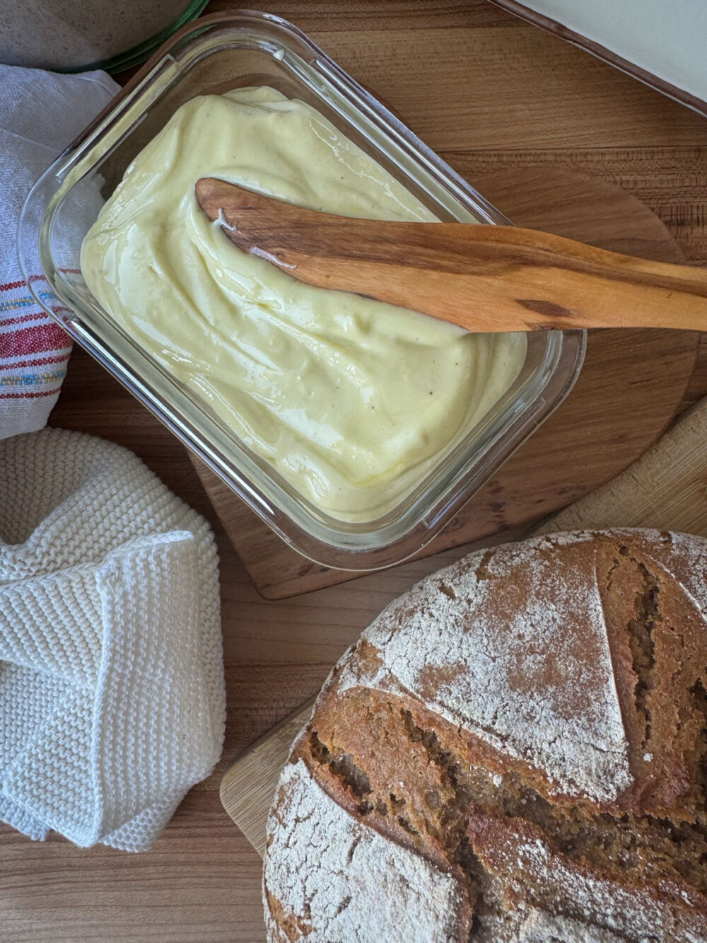 Cultured Homemade Spreadable Butter with Olive Oil Spreading probiotic filled cultured soft butter on einkorn wheat bread