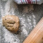 Whole Wheat Einkorn Sourdough Flatbread with a rolling pin