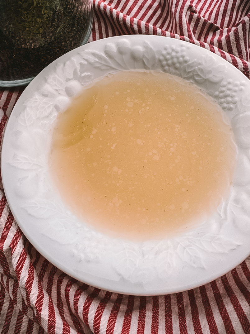 Easy Chicken Broth From a Whole Chicken chicken broth in a dinner bowl