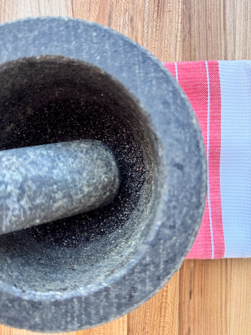 mortar and pestle and nigella sativa
