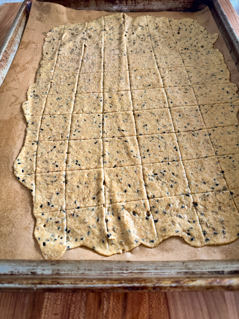 sourdough cracker dough on a sheet pan sourdough cracker dough on a sheet pan