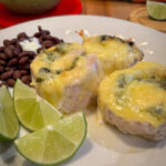 roasted poblano chicken dinner with black beans and lime wedges